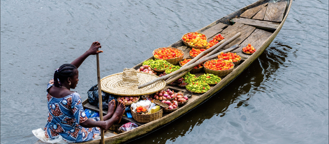 Photo of a woman on a boat in Benin