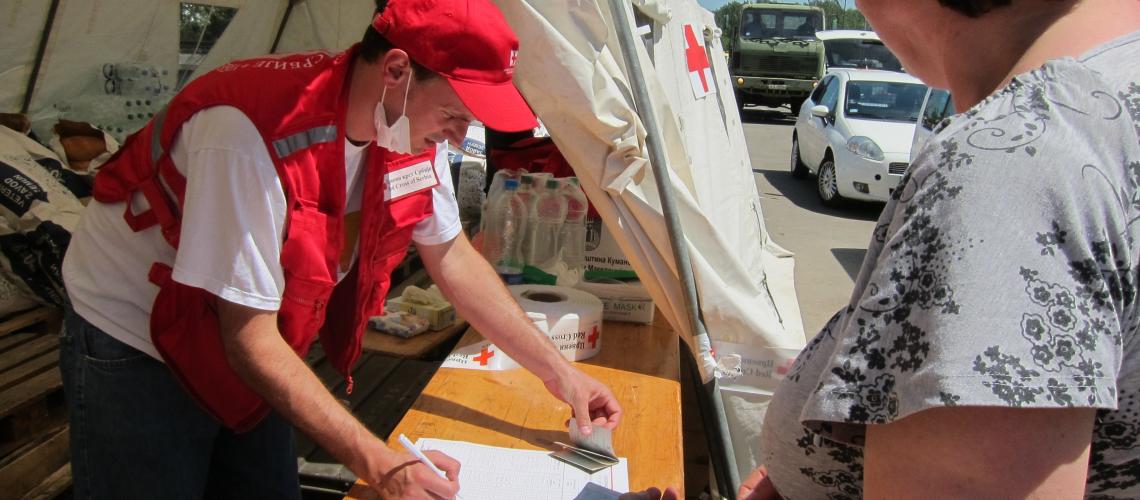 Humanitarian workers perusing paper documents