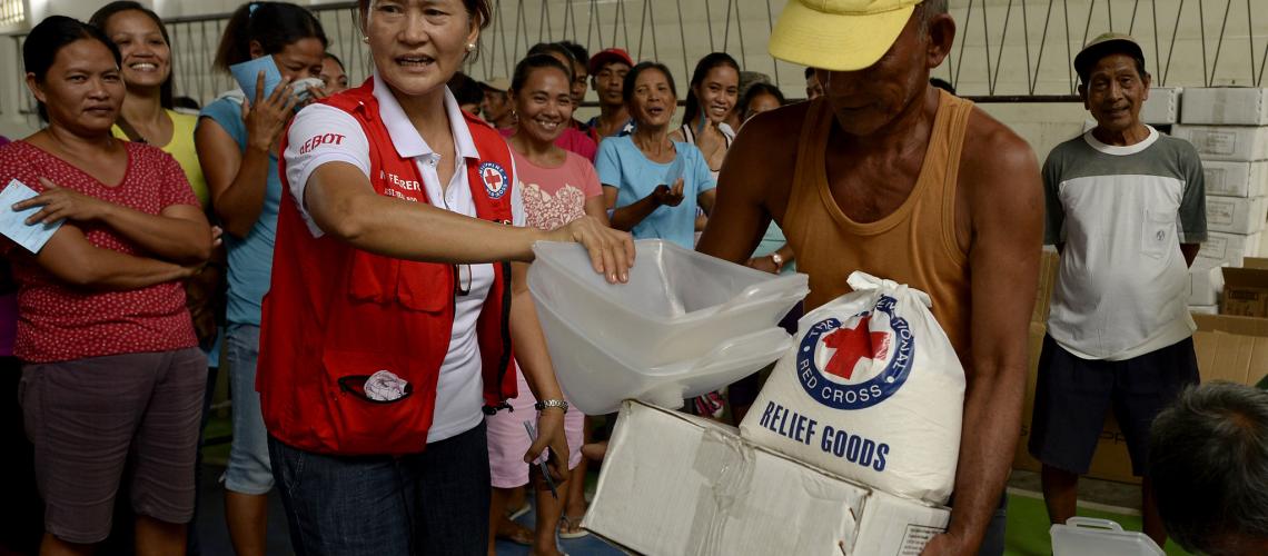 Humanitarian worker handing out resources