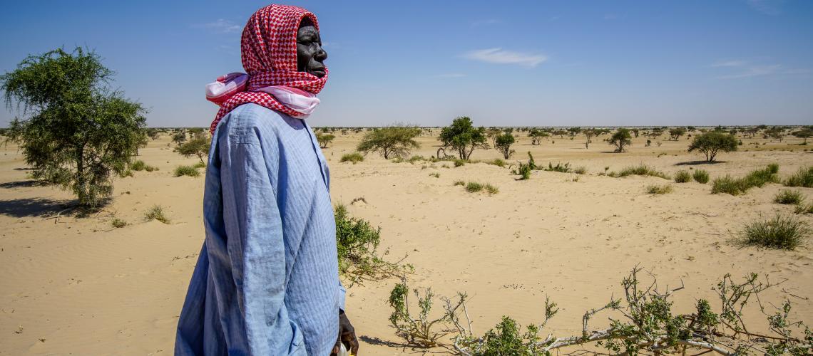 Woman standing in a desert