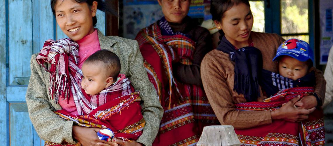 A group of women carrying babies