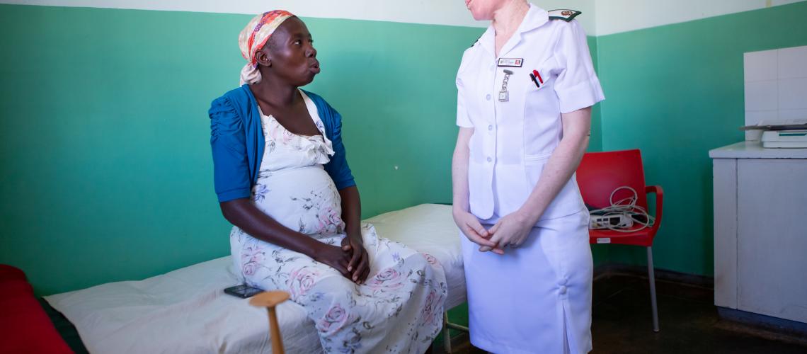 Woman patient and nurse speaking