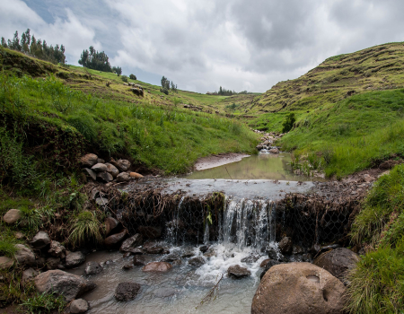 Water falling down a hill creek