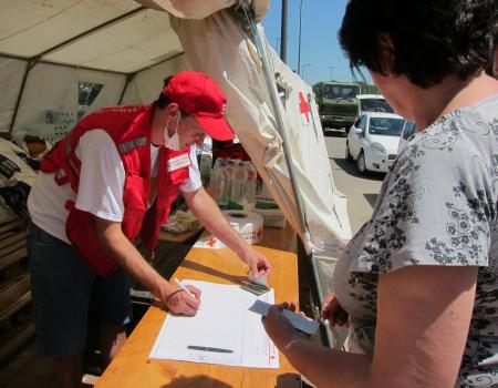 Humanitarian workers perusing paper documents