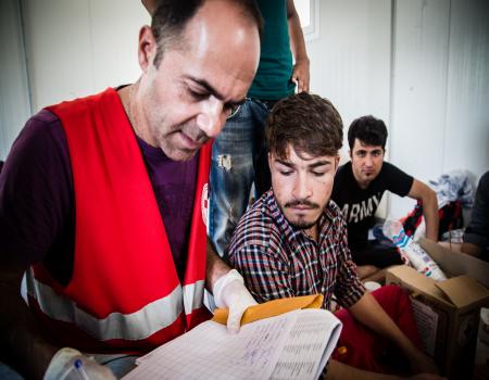 Men working together reading document