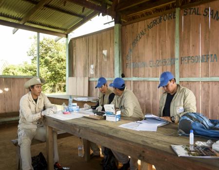 Men working together around a table