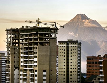 Tall buildings in front of a mountain