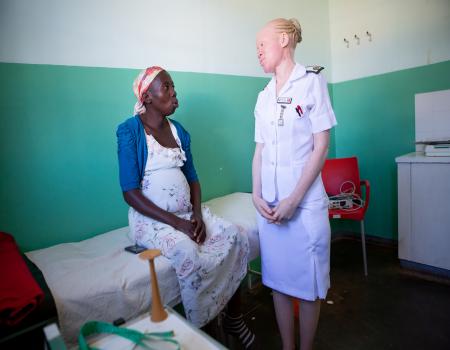 Woman patient and nurse speaking
