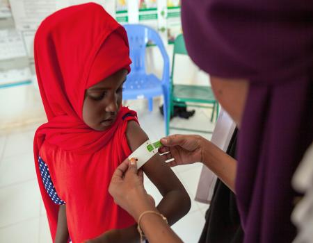 Young girl getting a measles shot
