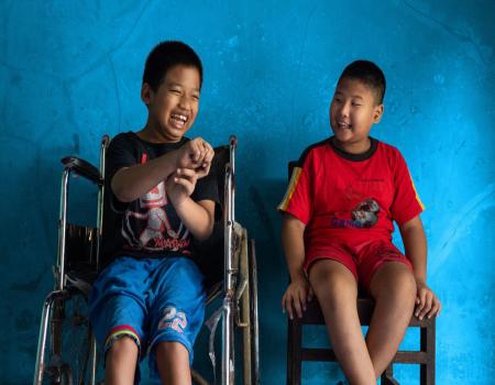 Two young boys in wheelchairs
