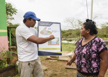 Bolivia man explaining to a woman