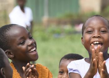 Photo of children laughing, including in the policymaker's digest for Ghana